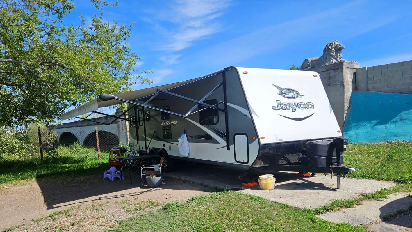 RV in an RV lot on a sunny day